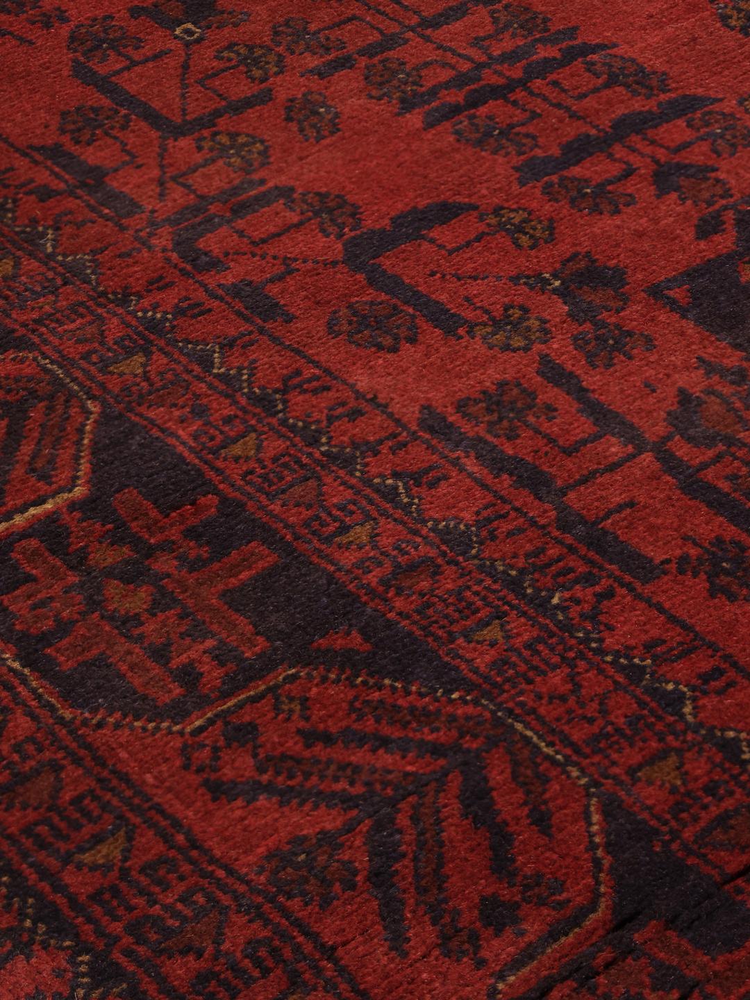 Hand-knotted Afghan Khal Mohammadi rug in deep red with geometric motifs