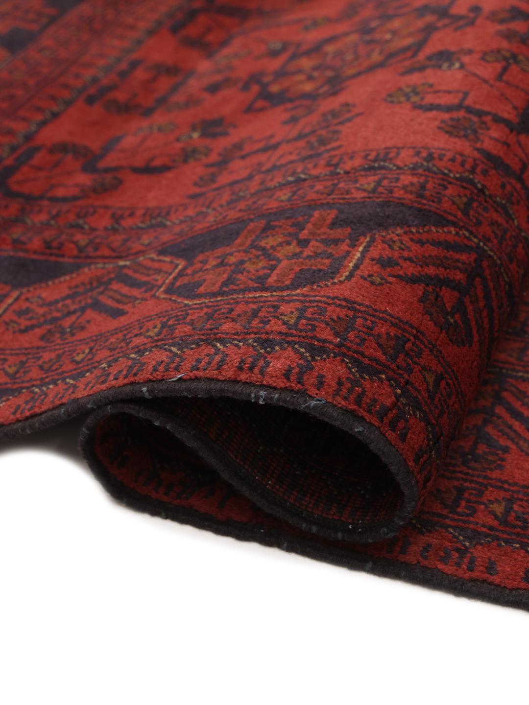 Hand-knotted Afghan Khal Mohammadi rug in deep red with geometric motifs