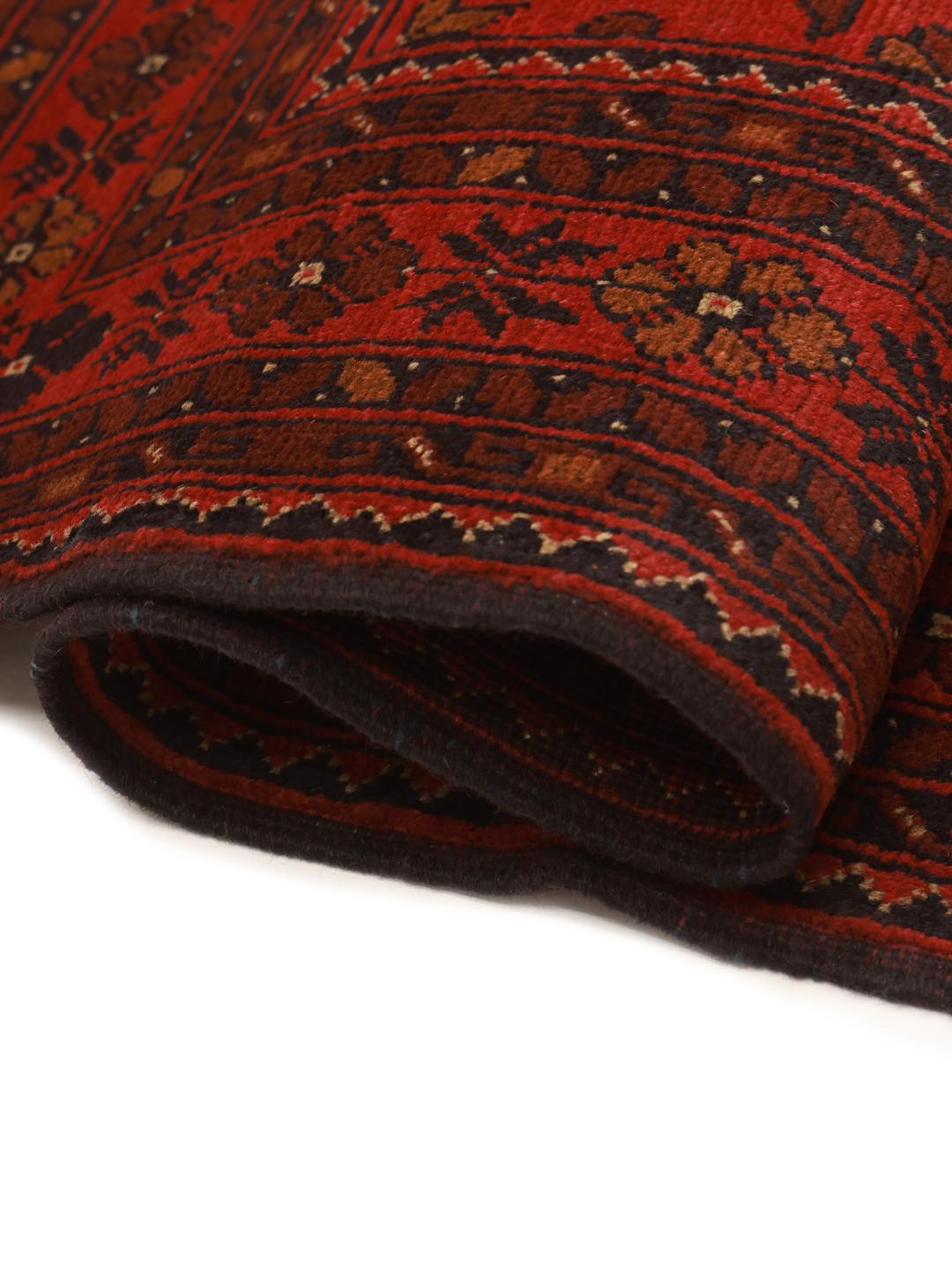 Hand-knotted Afghan Khal Mohammadi rug in deep red tones