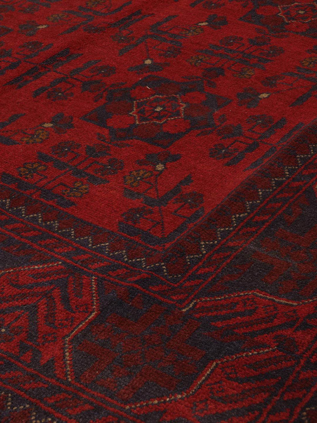 Hand-knotted Afghan Khal Mohammadi rug in rich red tones