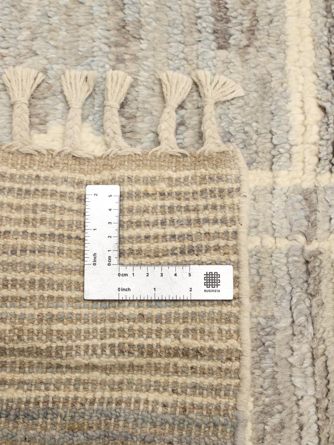 Håndknyttet tæppe fra Mellemøsten i beige og blå med geometriske mønstre