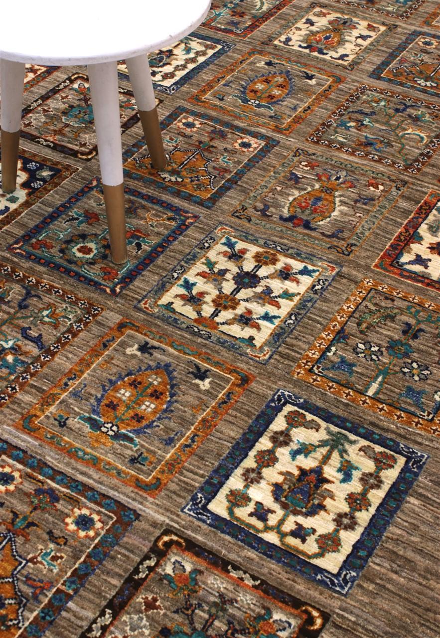 Hand knotted Wool rug from Afghanistan in brown with a panelled pattern