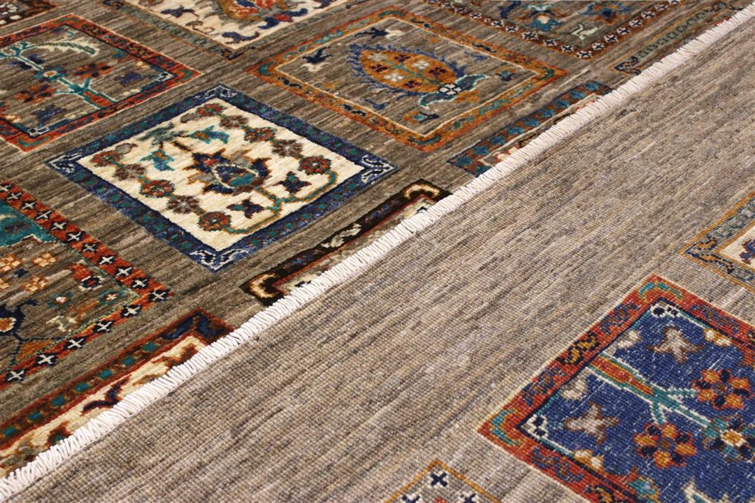 Hand knotted Wool rug from Afghanistan in brown with a panelled pattern