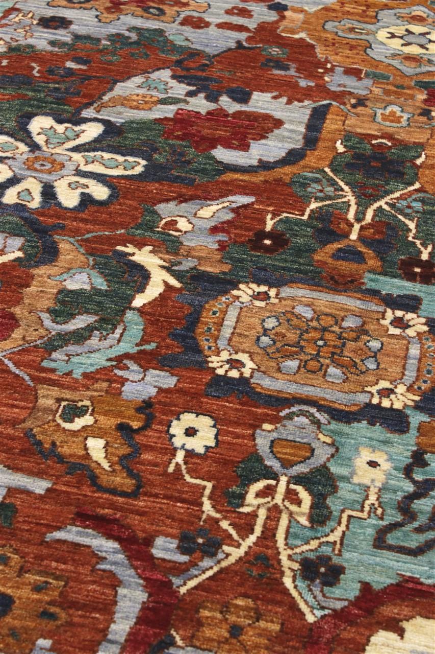 Alfombra afgana anudada a mano con un vibrante diseño floral y geométrico multicolor