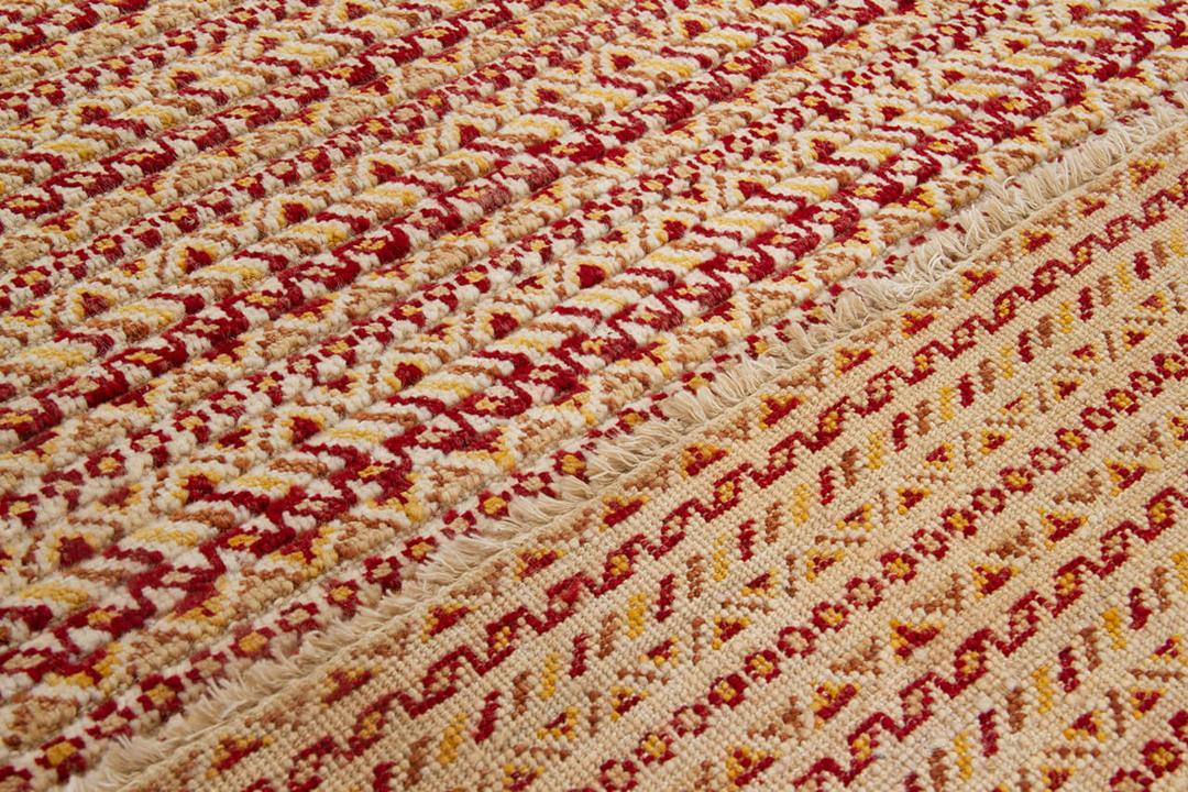 Handgeknoopt Gabbeh-tapijt uit Afghanistan in rode en beige tinten