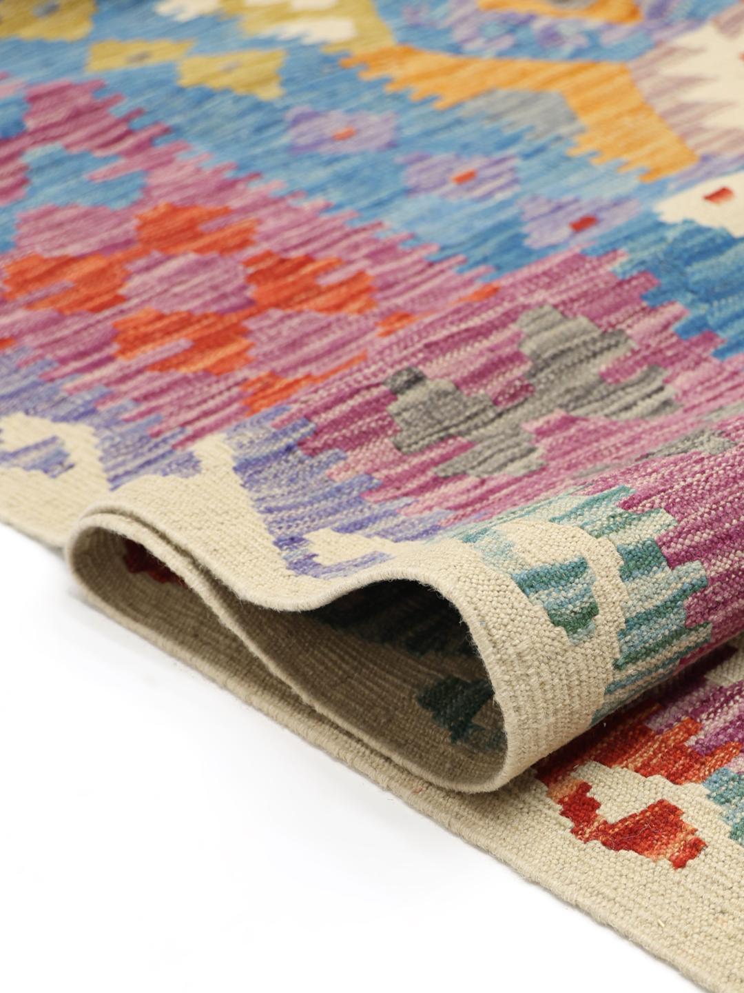 Hand-woven Afghan Kelim rug featuring a colourful geometric diamond pattern
