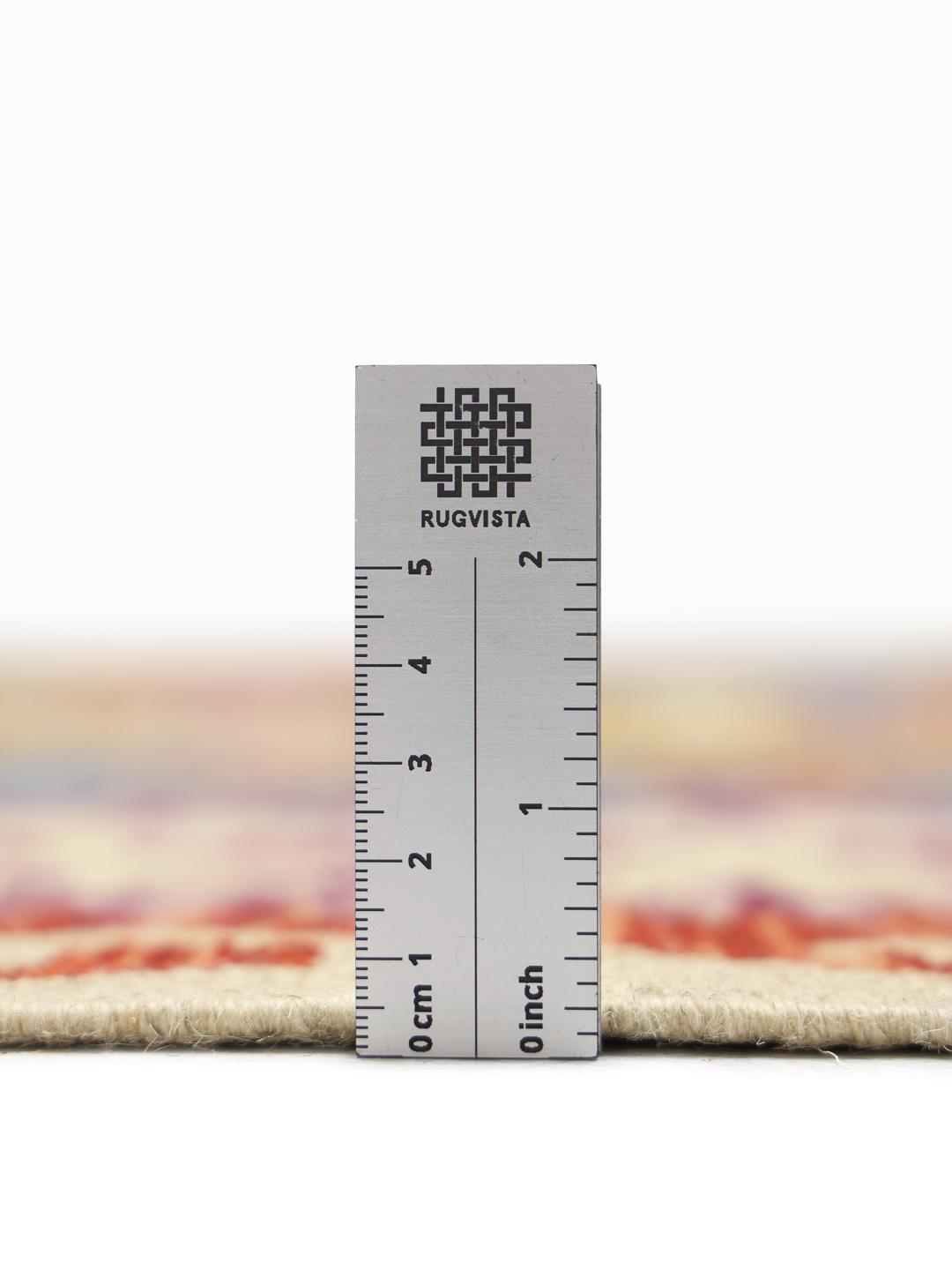 Hand-woven Afghan Kelim rug featuring a colourful geometric diamond pattern