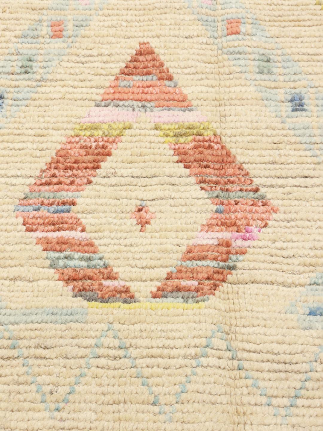 Hand-knotted Afghan rug with a beige base and colourful geometric patterns