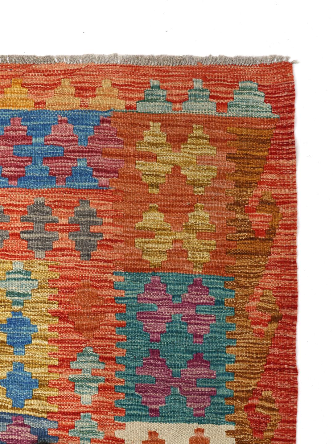 Hand-woven Afghan Kelim rug featuring a colourful diamond pattern