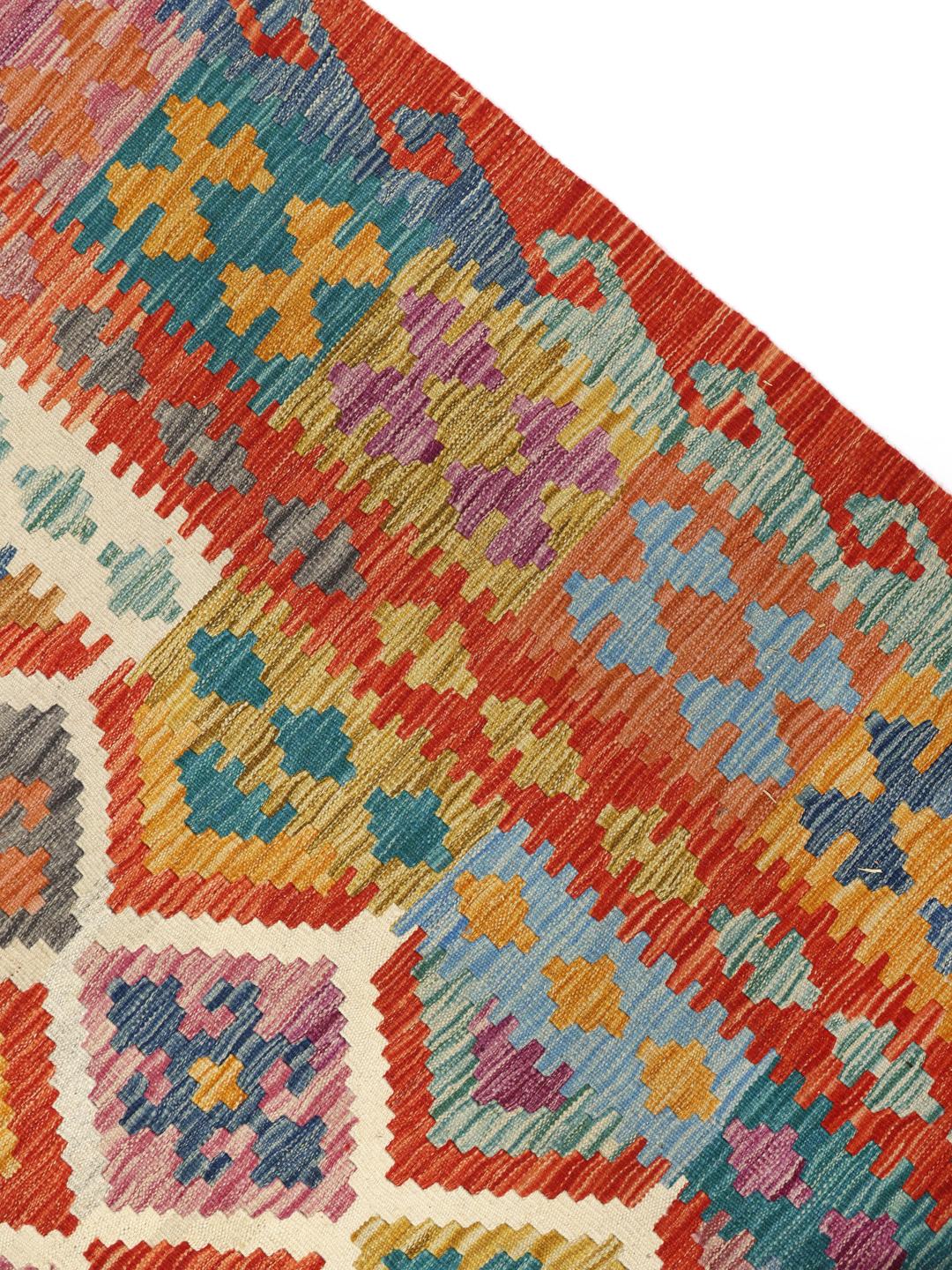 Hand-woven Afghan Kelim rug featuring a colourful diamond pattern
