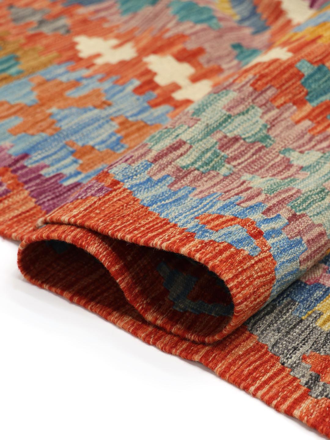 Hand-woven Afghan Kelim rug featuring a colourful diamond pattern