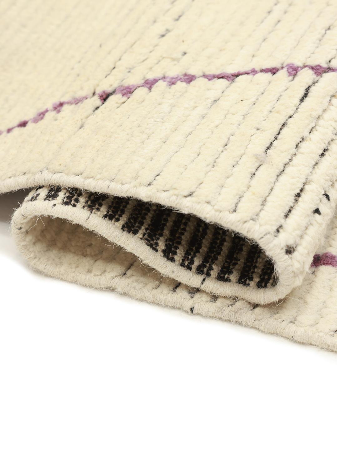 Hand-knotted Berber Style rug from Afghanistan with a multicolor geometric design on a beige field.