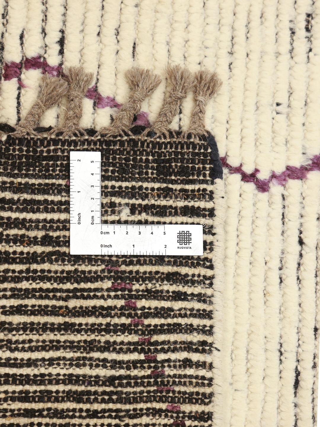 Hand-knotted Berber Style rug from Afghanistan with a multicolor geometric design on a beige field.