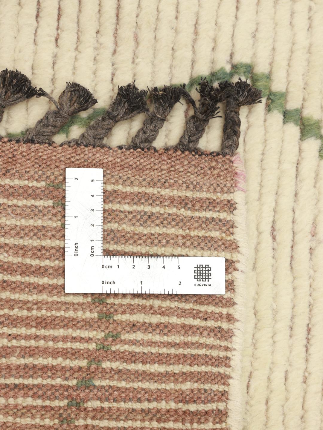 Hand-knotted Berber style rug from Afghanistan with colourful diamond patterns on a beige background