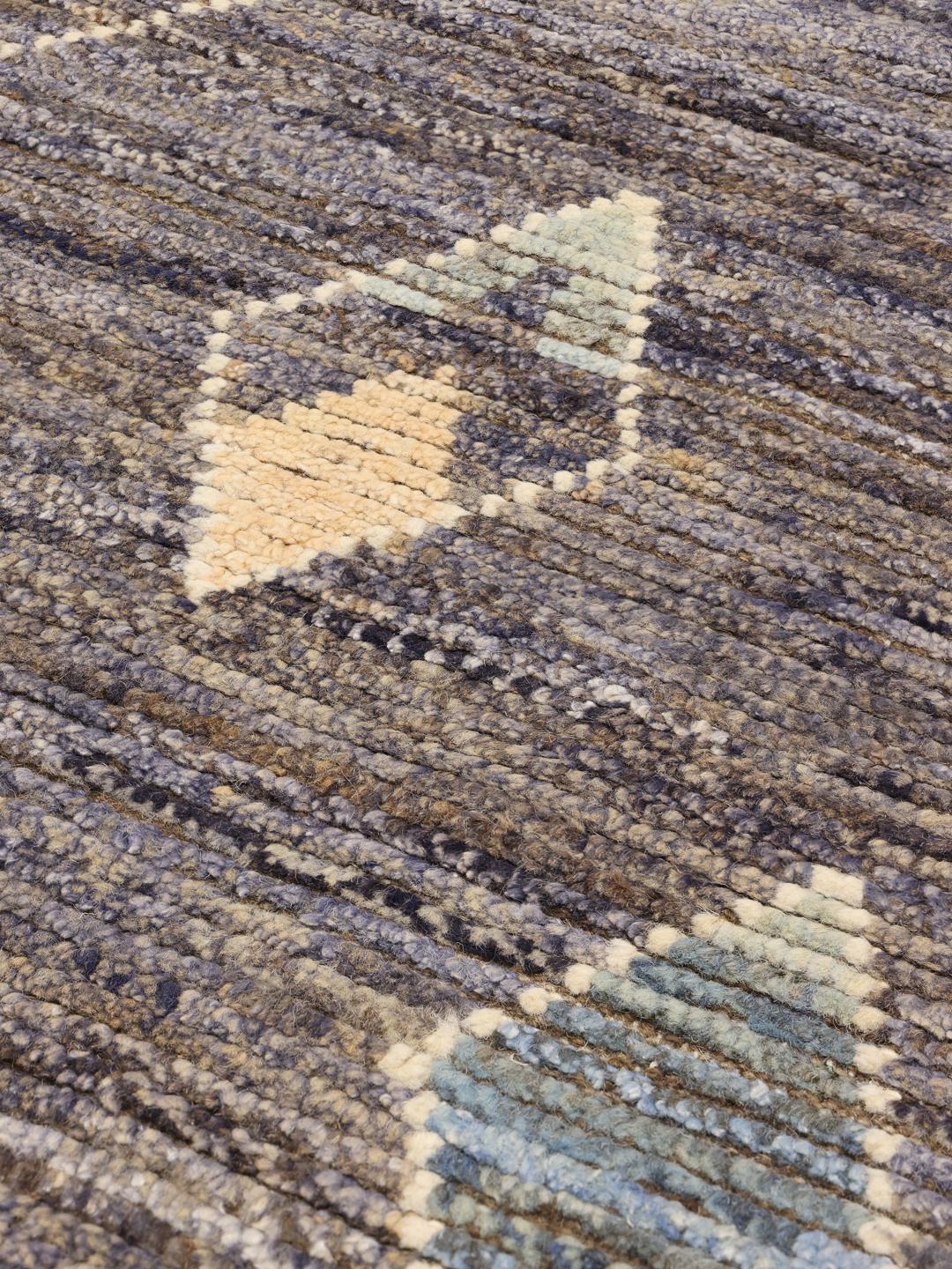 Hand-knotted Afghan rug with blue tones and geometric diamond patterns