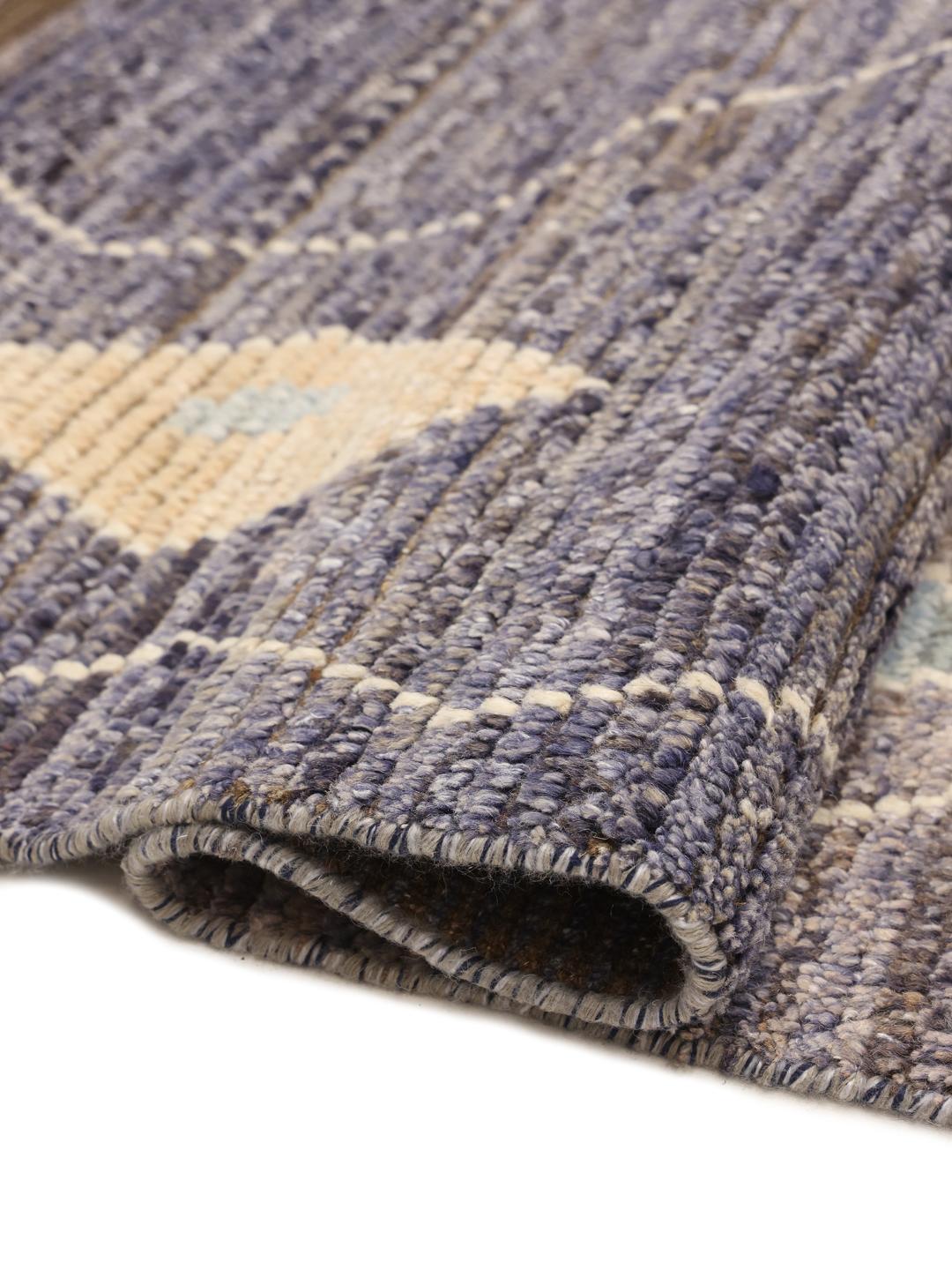 Hand-knotted Afghan rug with blue tones and geometric diamond patterns