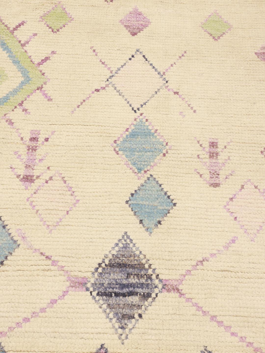 Hand-knotted Berber-inspired rug from Afghanistan with a beige field and multicolor diamond motifs