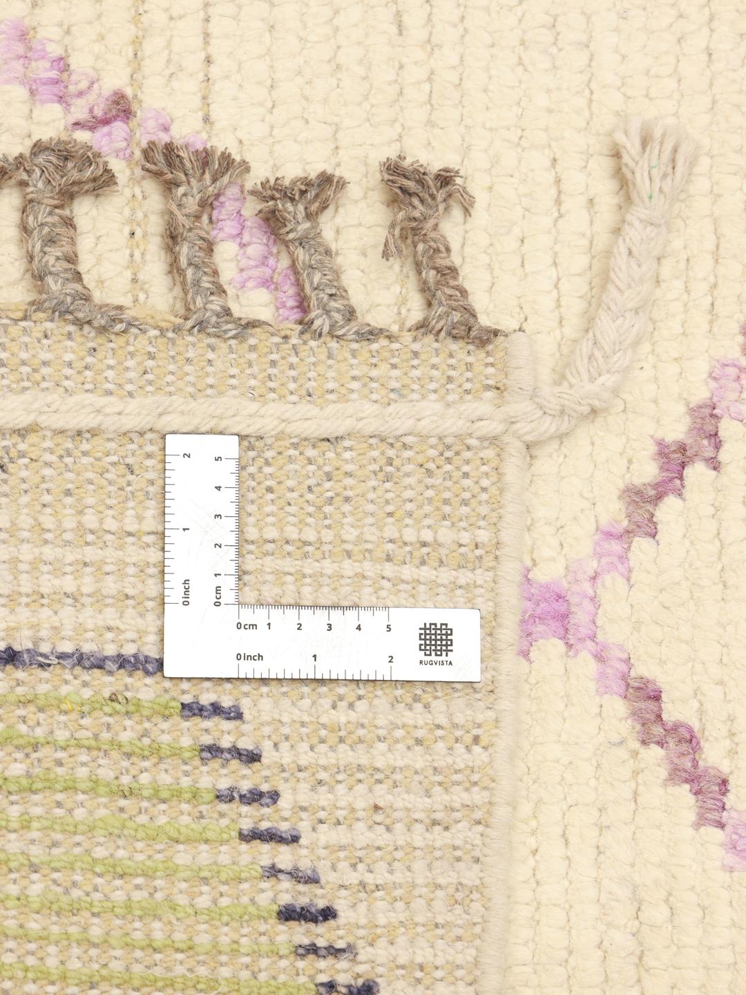 Hand-knotted Berber-inspired rug from Afghanistan with a beige field and multicolor diamond motifs