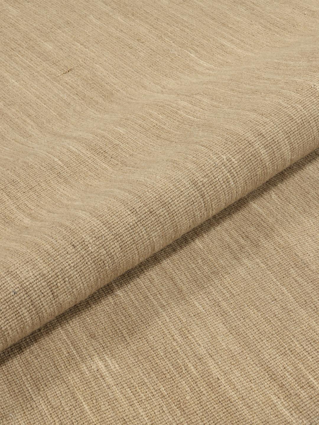 Beige rundt tæppe