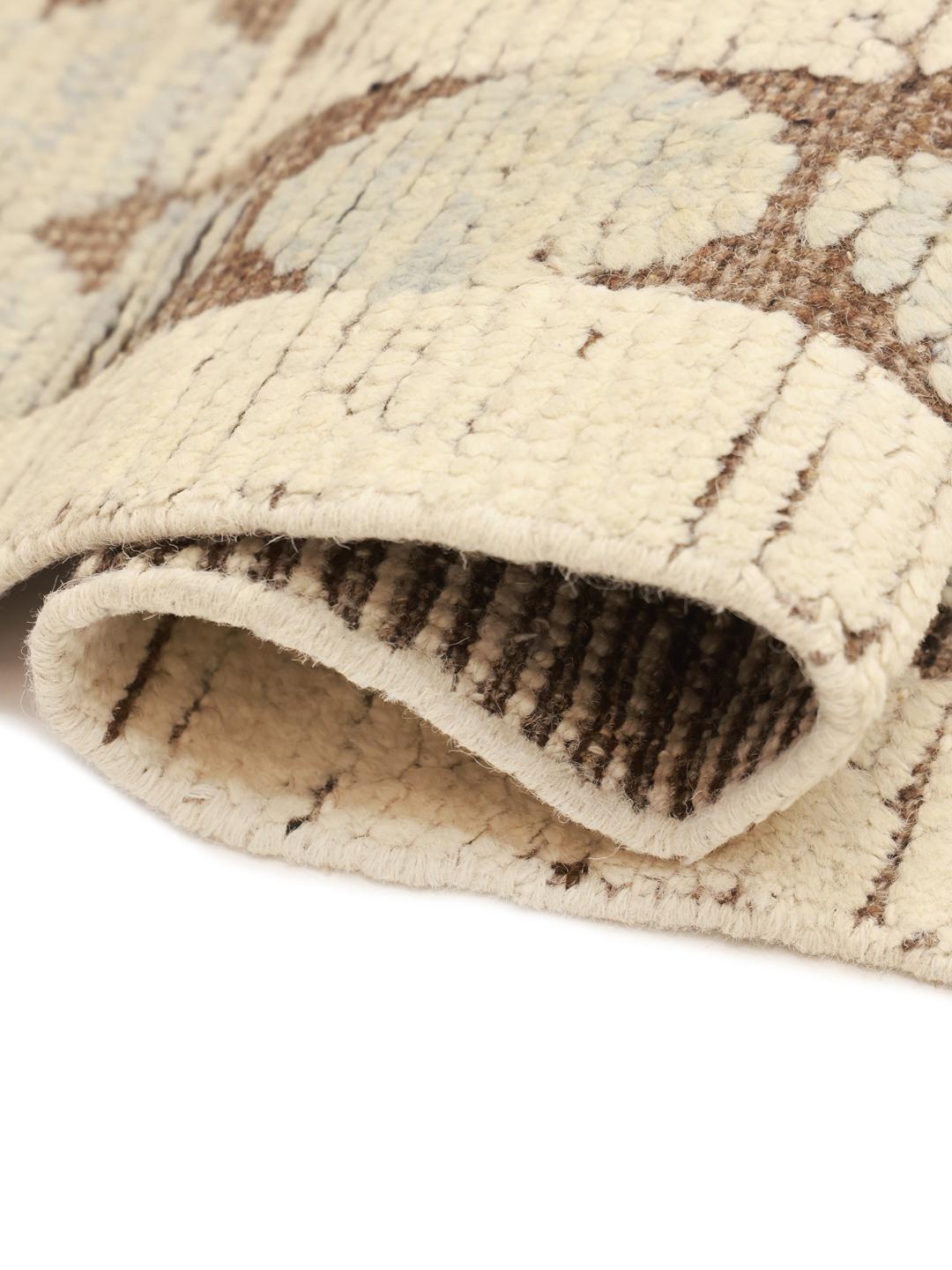 Hand-knotted Afghan rug with a geometric diamond pattern in beige and soft blue tones