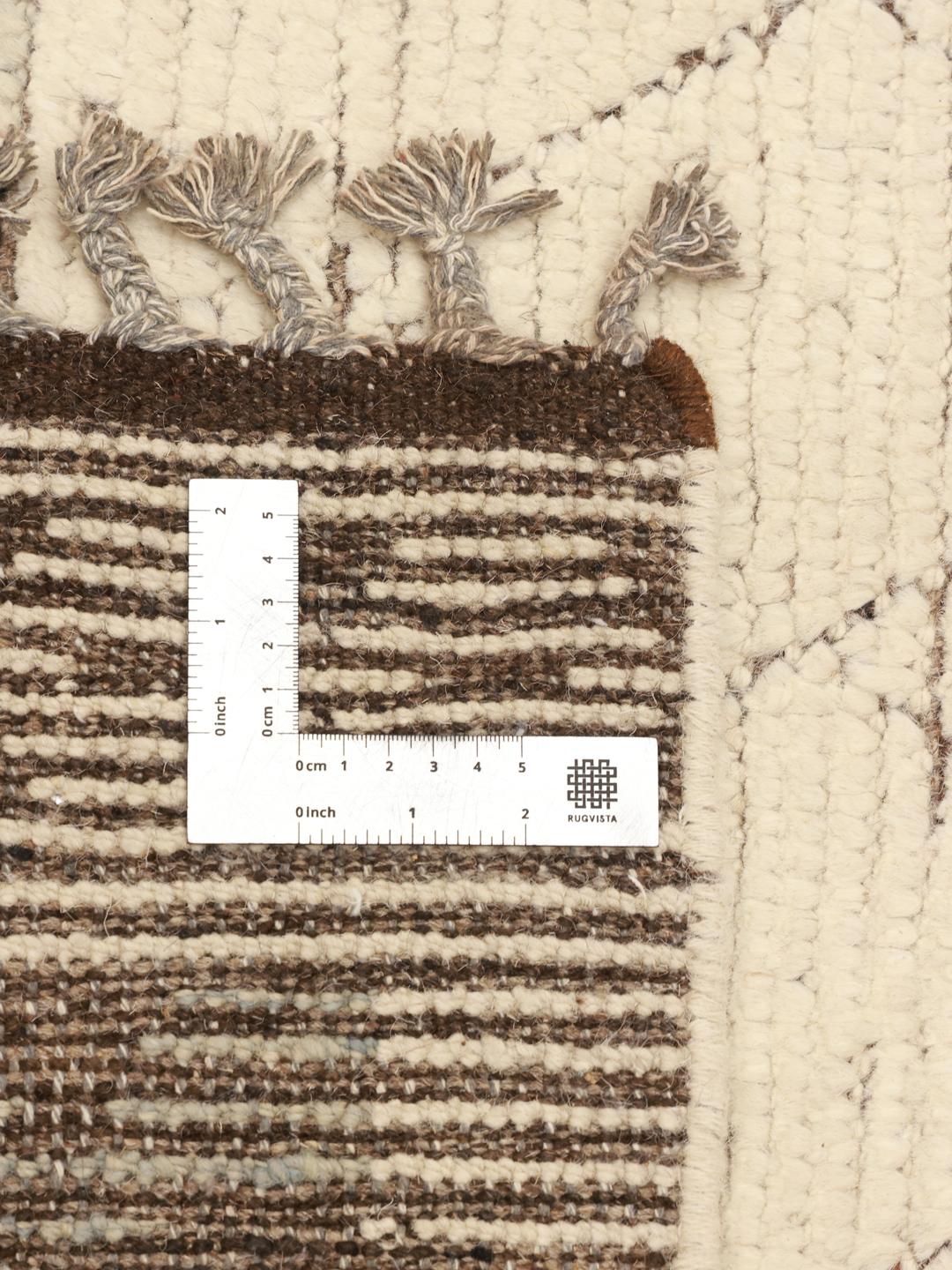 Hand-knotted Afghan rug with a geometric diamond pattern in beige and soft blue tones