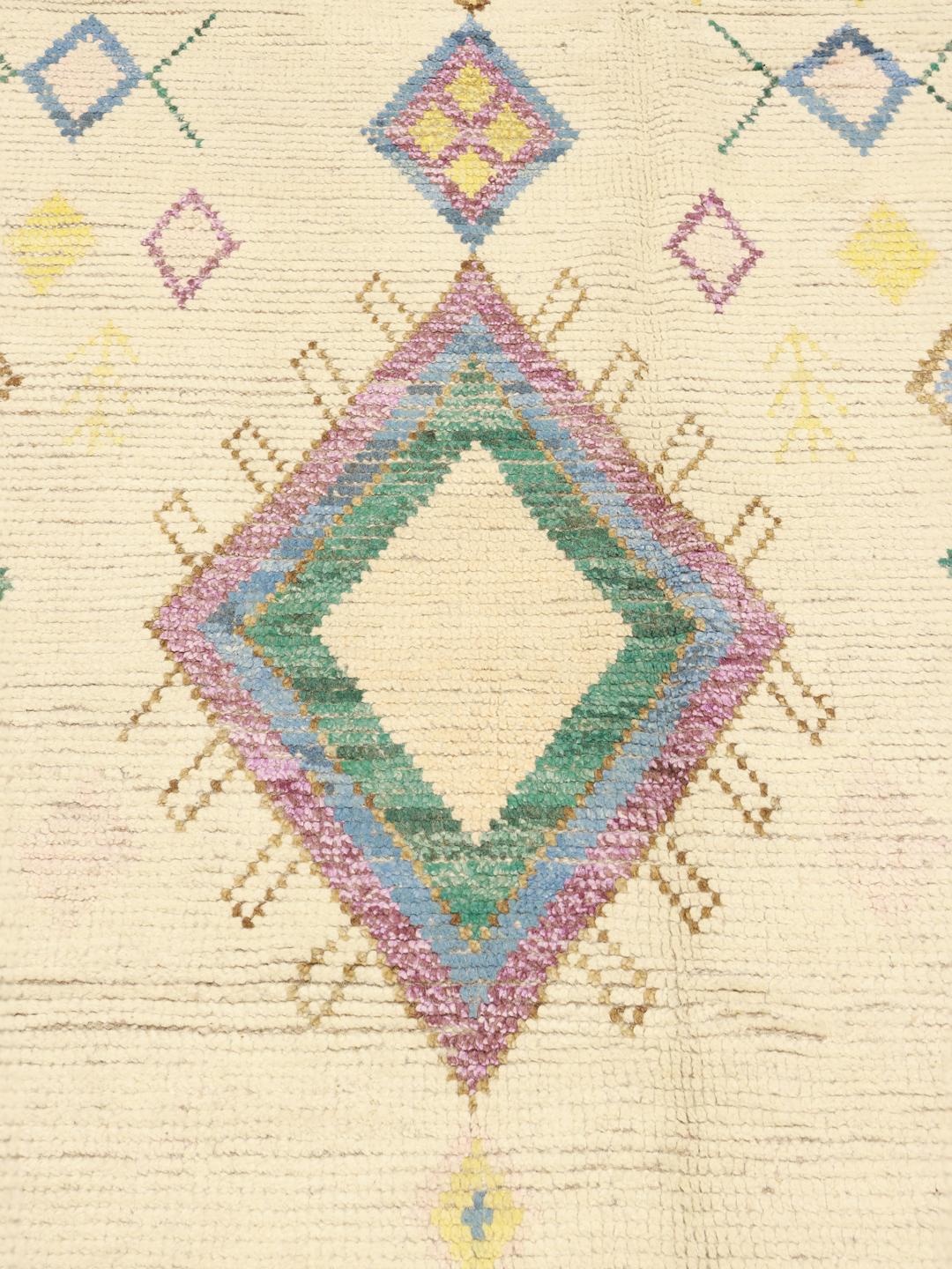 Hand-knotted Afghan rug with colourful diamond motifs on a beige background