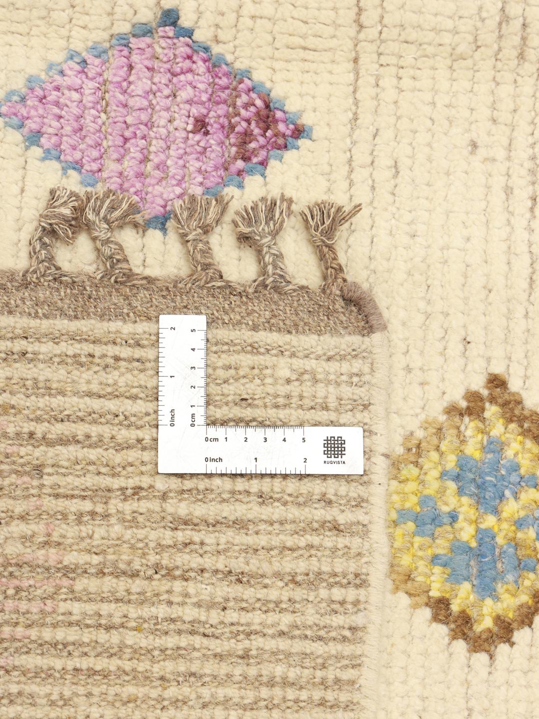 Hand-knotted Afghan rug with colourful diamond motifs on a beige background