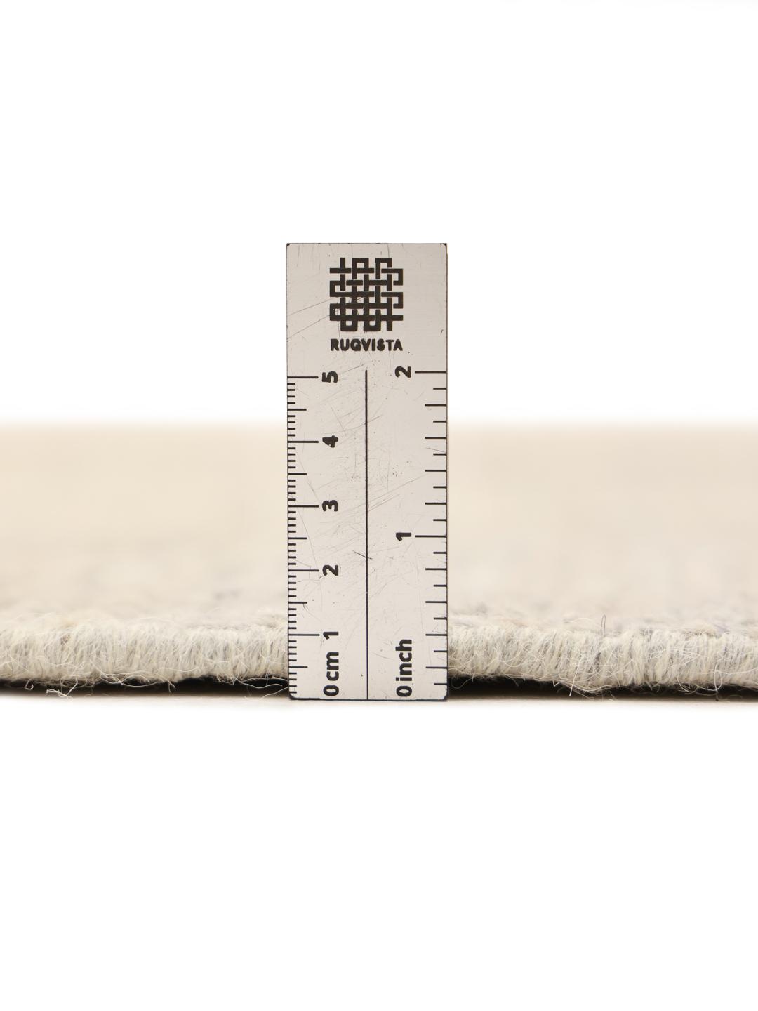 Hand-knotted Berber style rug from Afghanistan in a soft beige colour with a diamond pattern