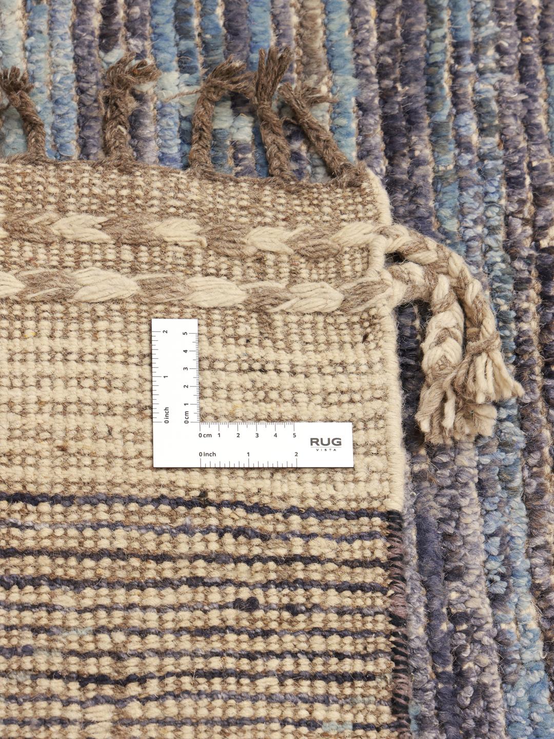Hand-knotted Afghan rug with neutral tones and artistic motifs