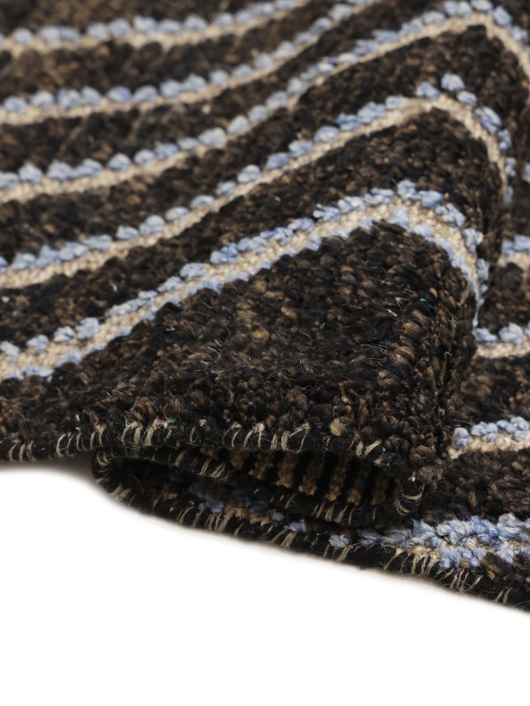 A large hand-knotted rug from Afghanistan with a monochrome zig-zag pattern