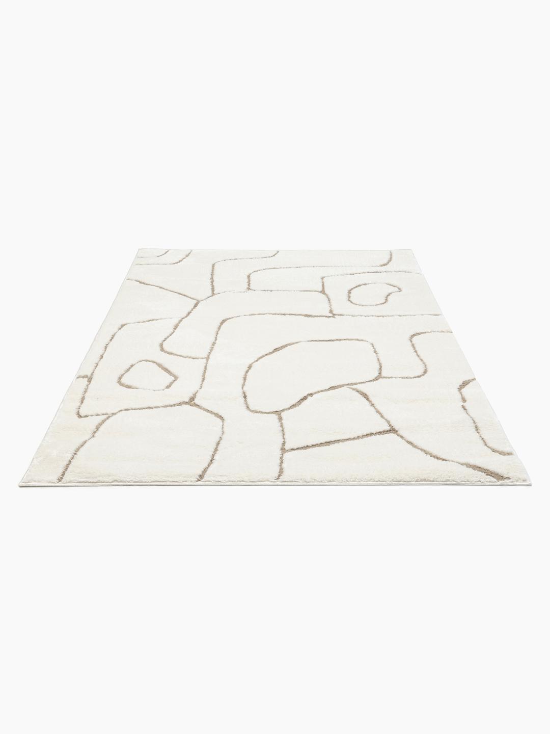 Hvidt og beige tæppe med design i høj og lav luv