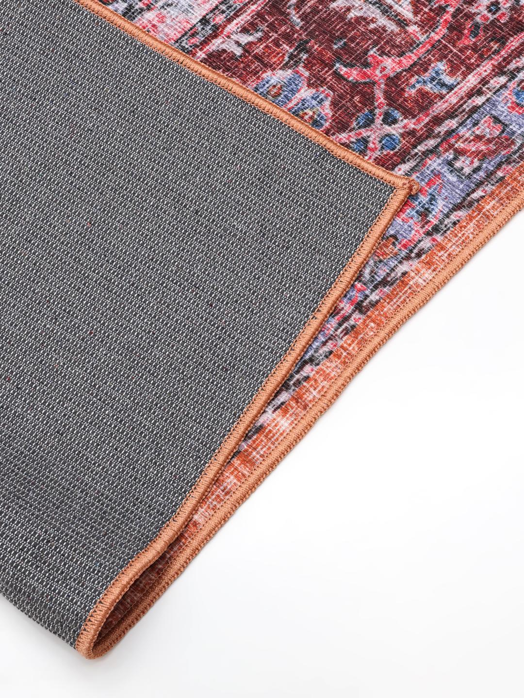 Rood en blauw oosters stijl vloerkleed met een centraal medaillonontwerp