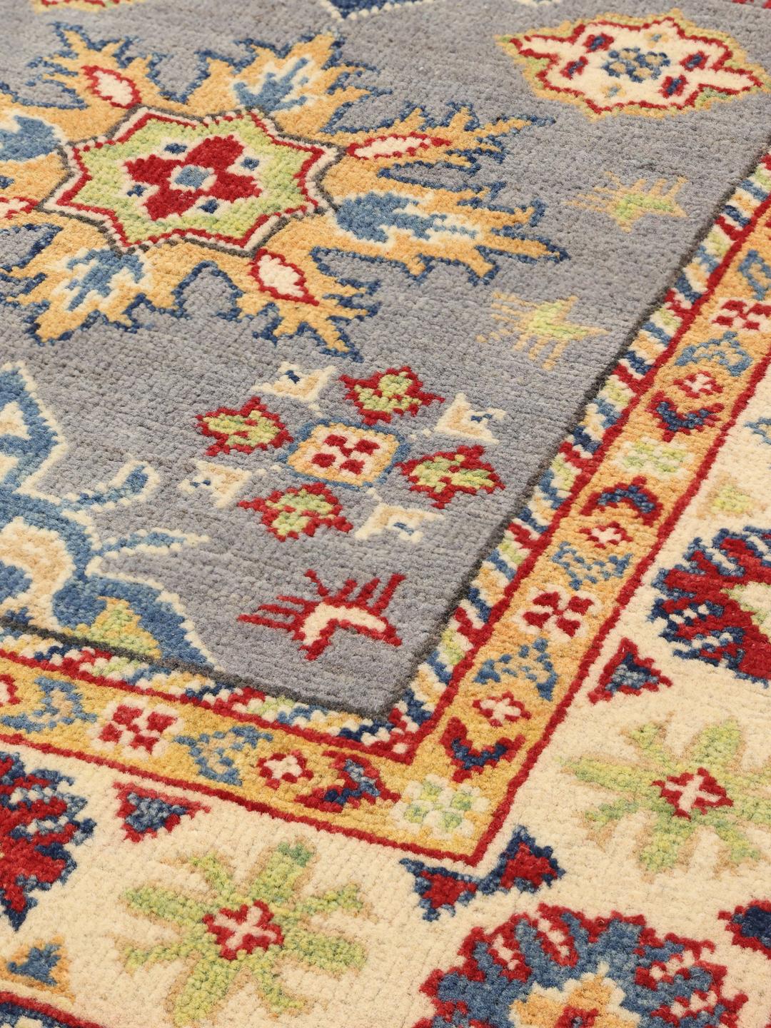 Handgeknüpfter afghanischer Kazak-Läufer mit blauen, roten und gelben geometrischen Mustern