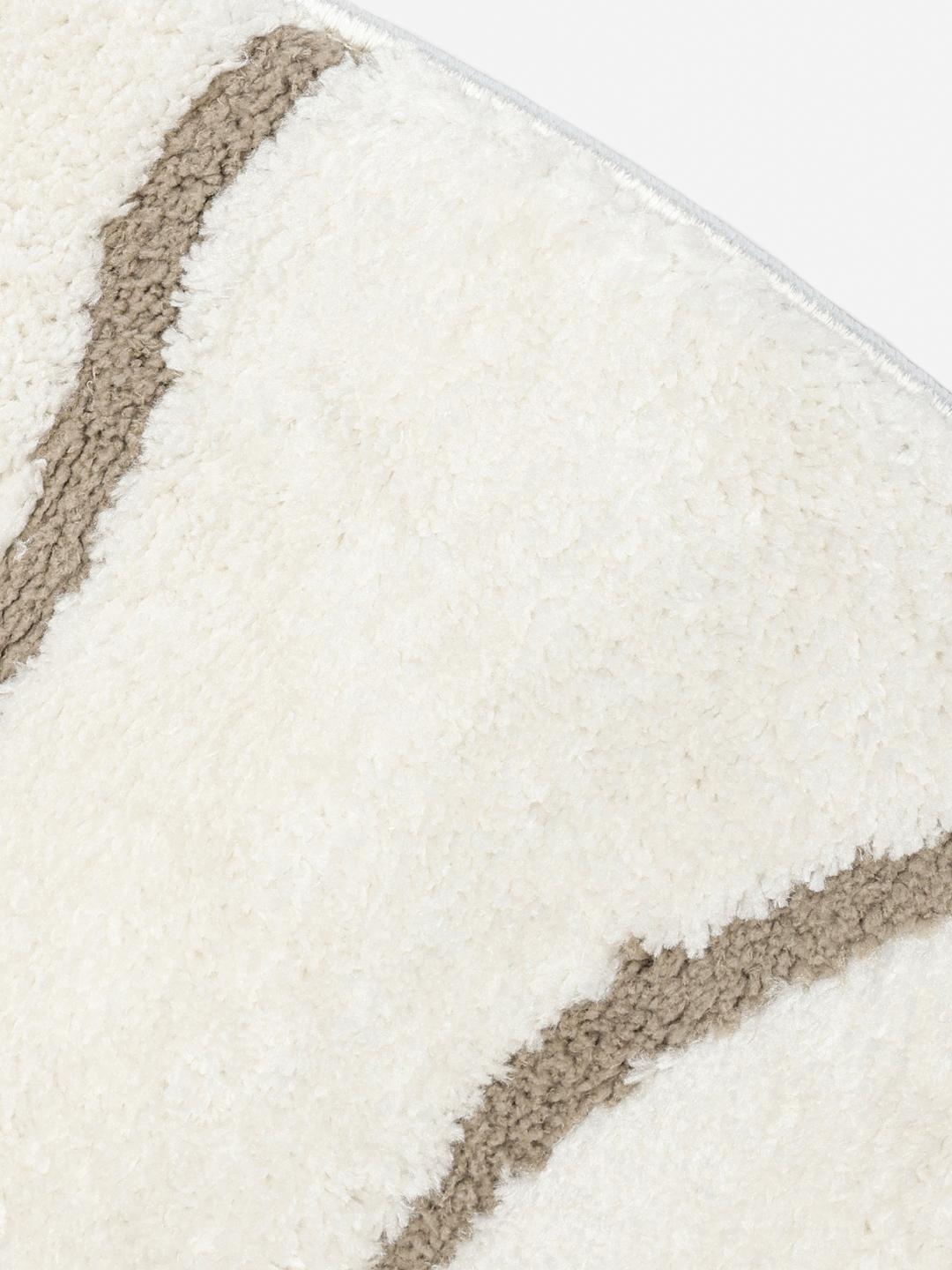 rundt tæppe i hvid og beige