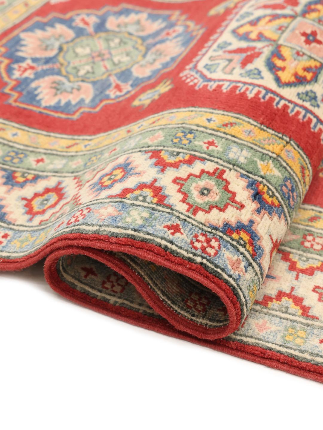 Hand-knotted Afghan runner in vibrant red with geometric patterns