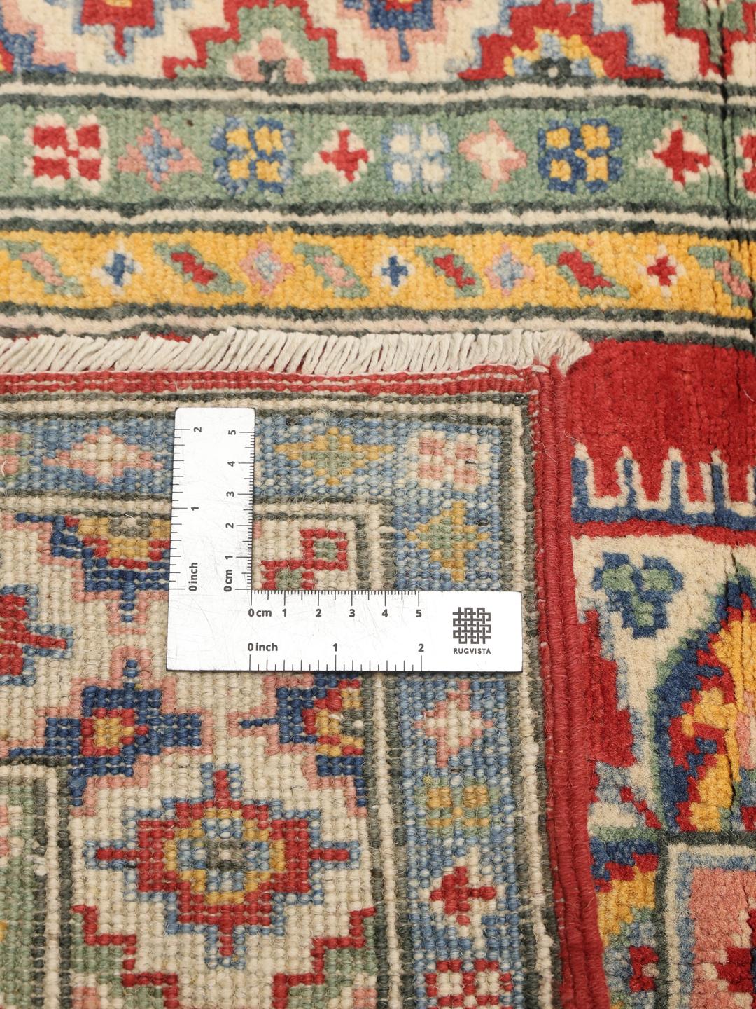 Hand-knotted Afghan runner in vibrant red with geometric patterns