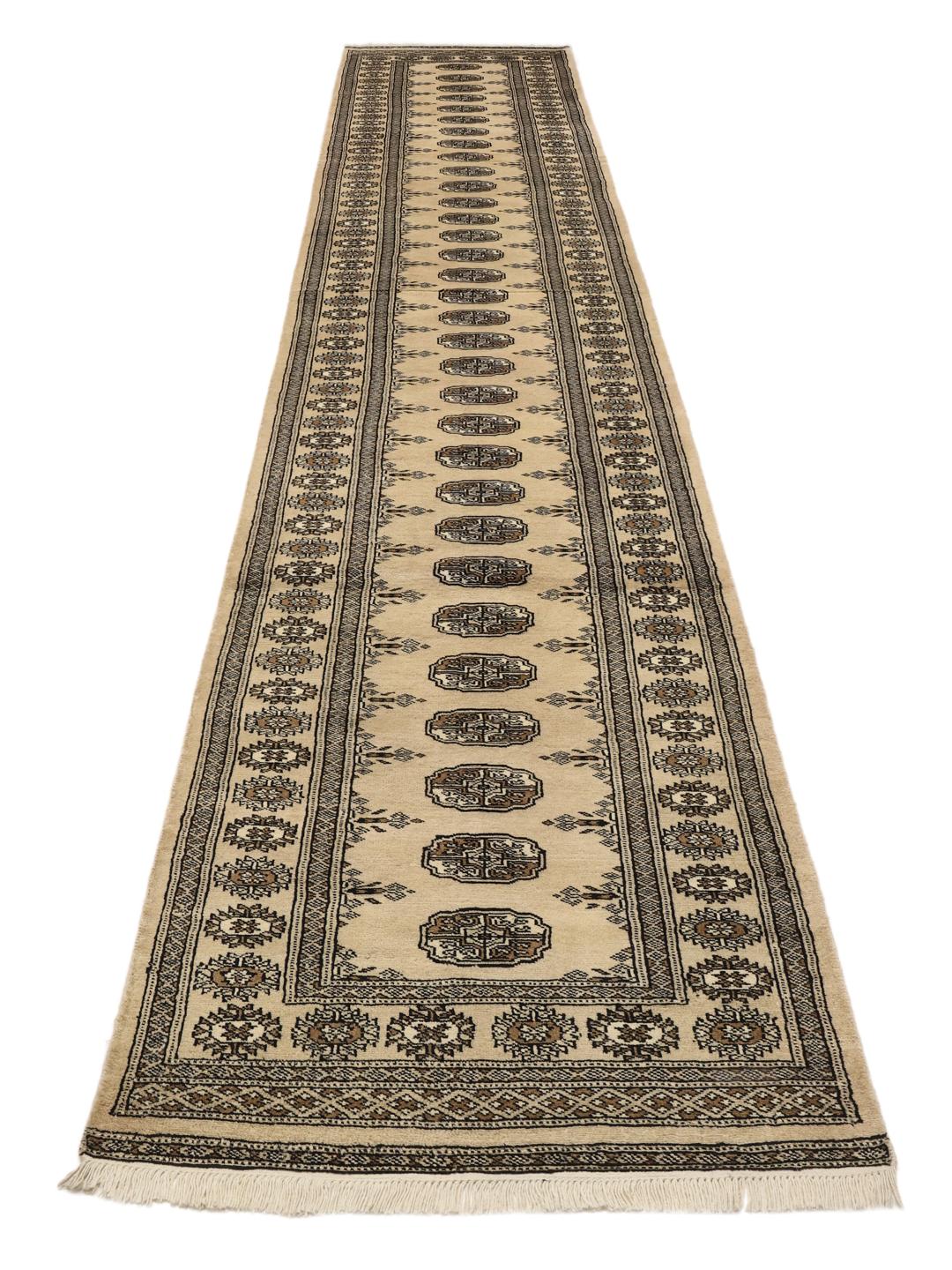 Hand-knotted Pakistani runner rug in beige with repeating motifs