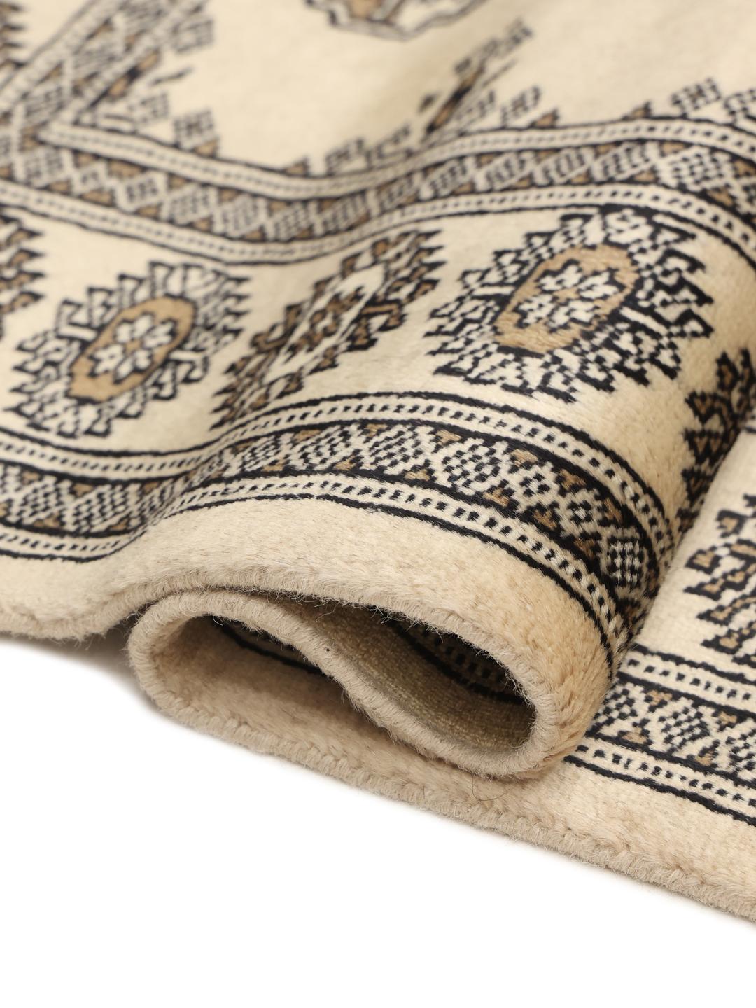 Hand-knotted Pakistani runner rug in beige with repeating motifs
