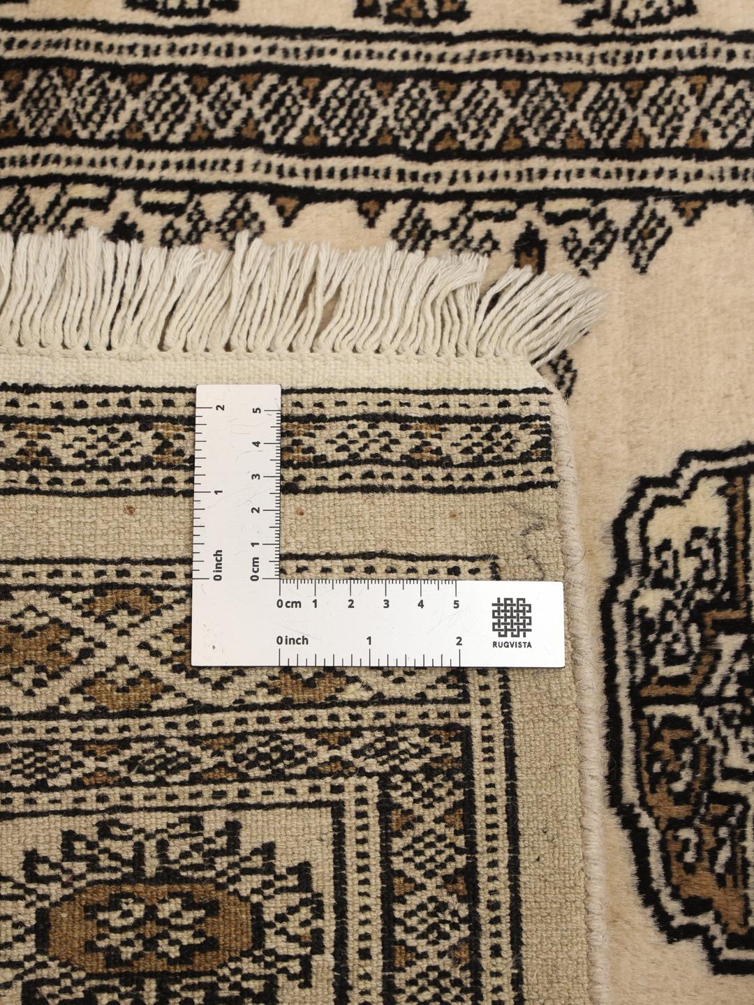Hand-knotted Pakistani runner rug in beige with repeating motifs