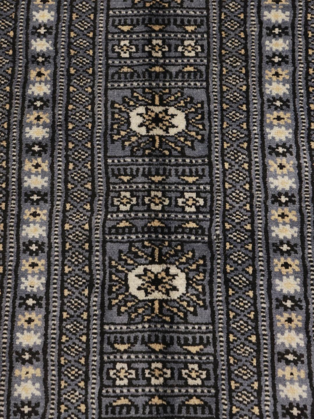 Hand-knotted Pakistani rug in grey with traditional geometric motifs