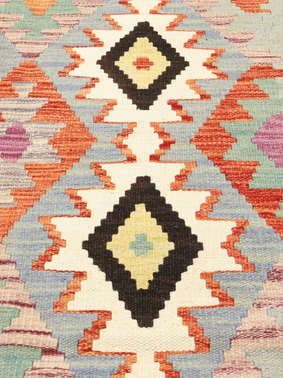 Tapis Kelim Afghan tissé à la main avec des motifs géométriques vibrants en laine multicolore