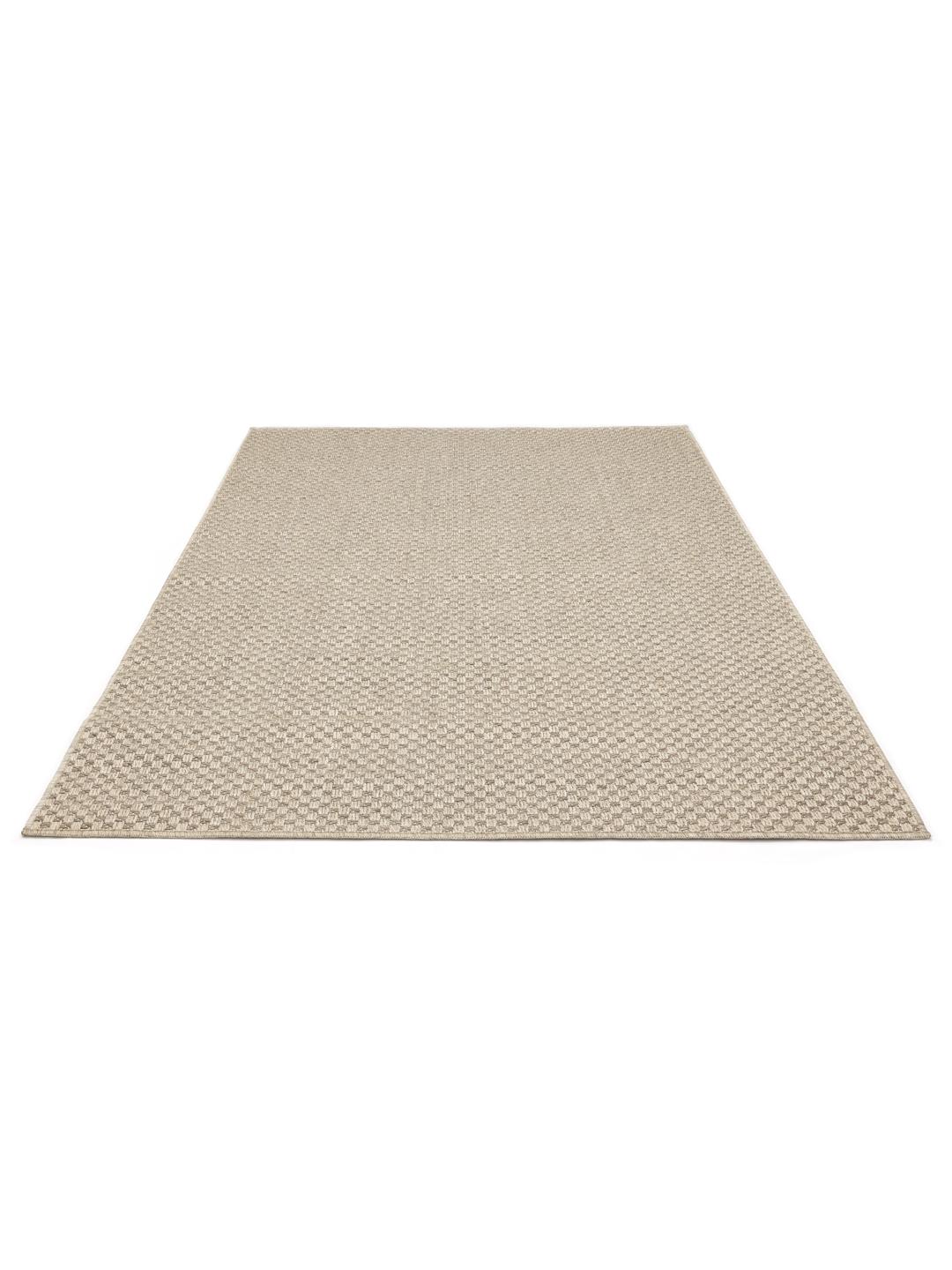 Beige tæppe med et struktureret mønster