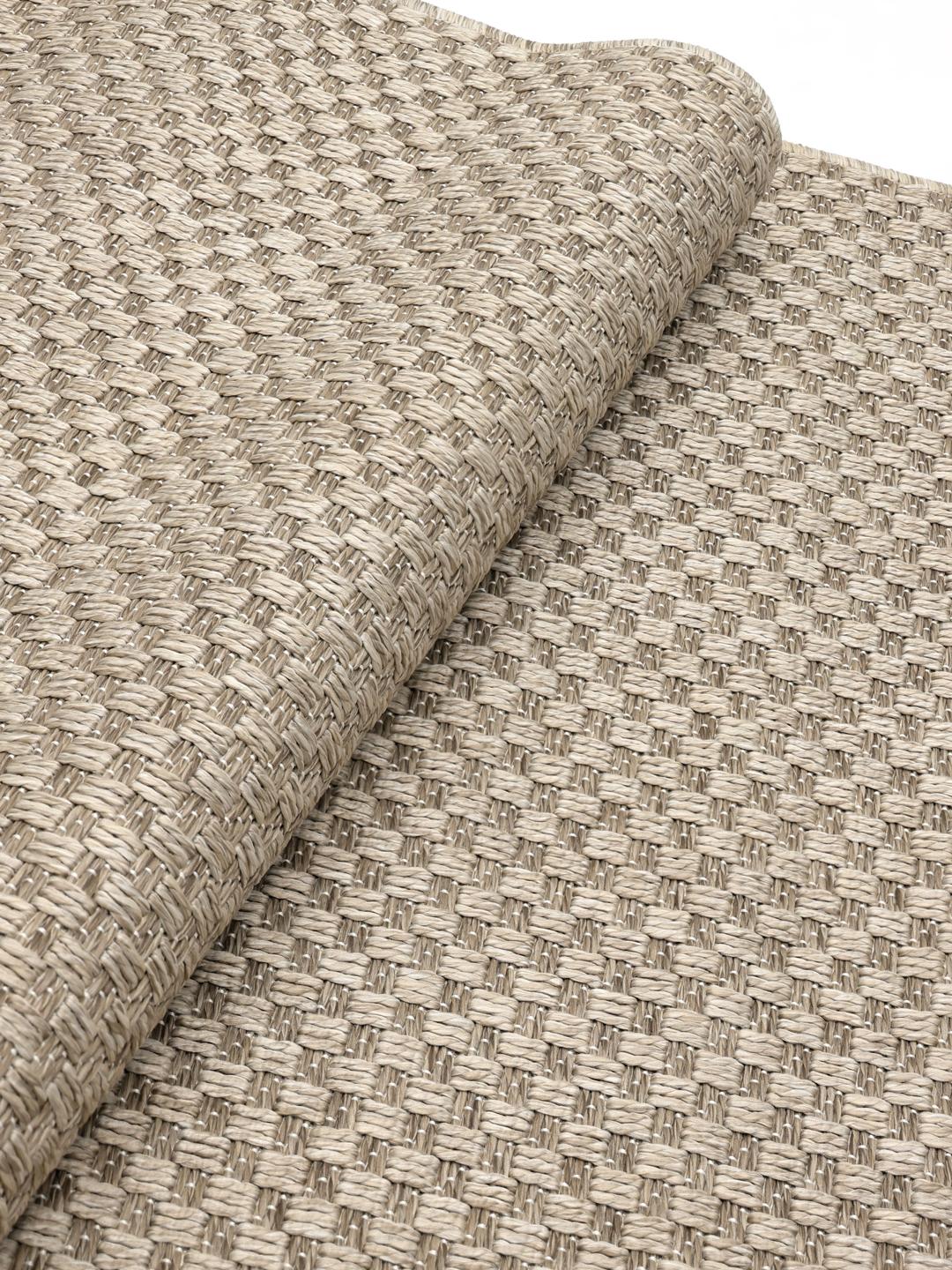 Beige tæppe med et struktureret mønster