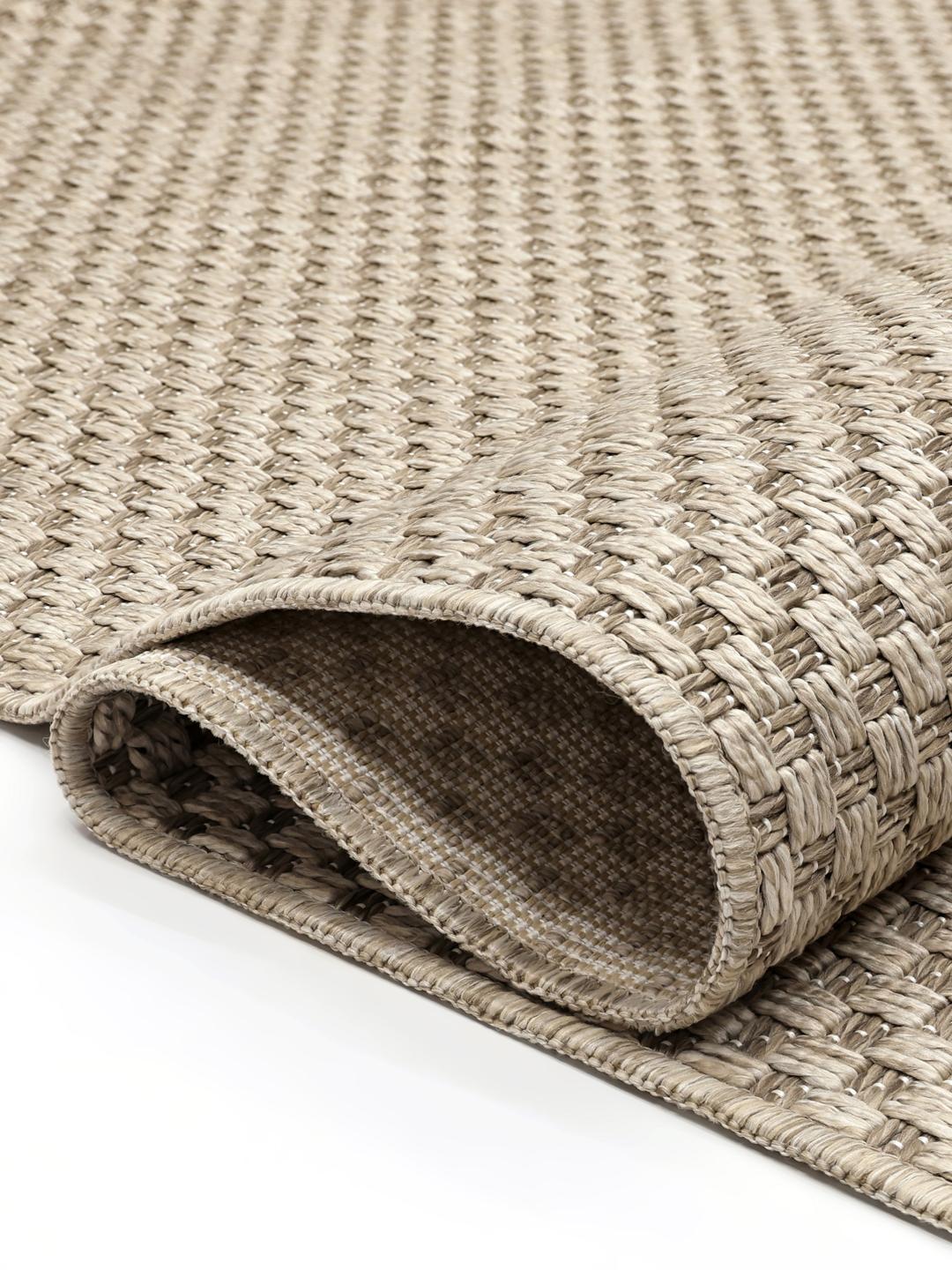 Beige vloerkleed met een gestructureerd patroon