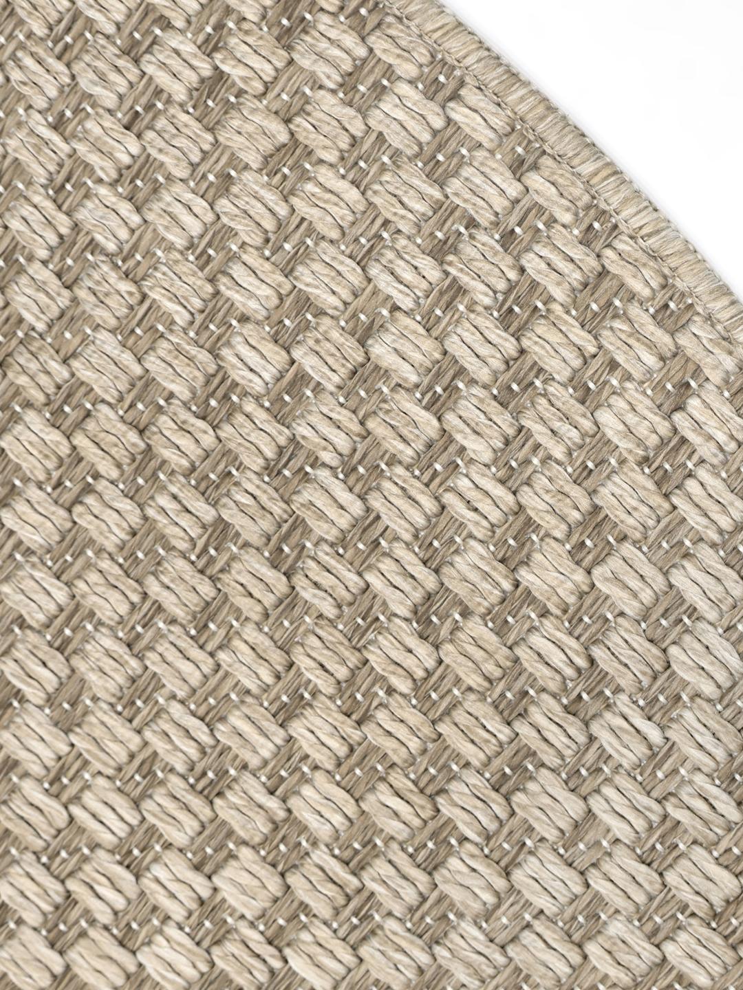Rundt beige og brun mønstret tæppe