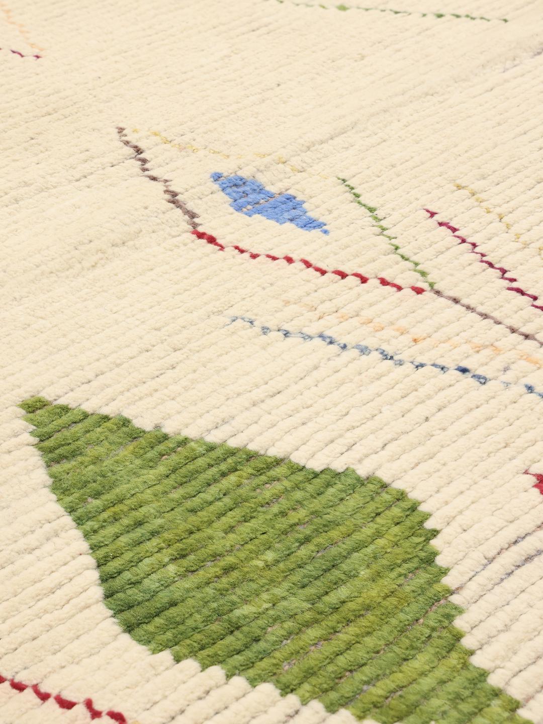Hand-knotted Afghan rug with colourful geometric motifs on a beige background