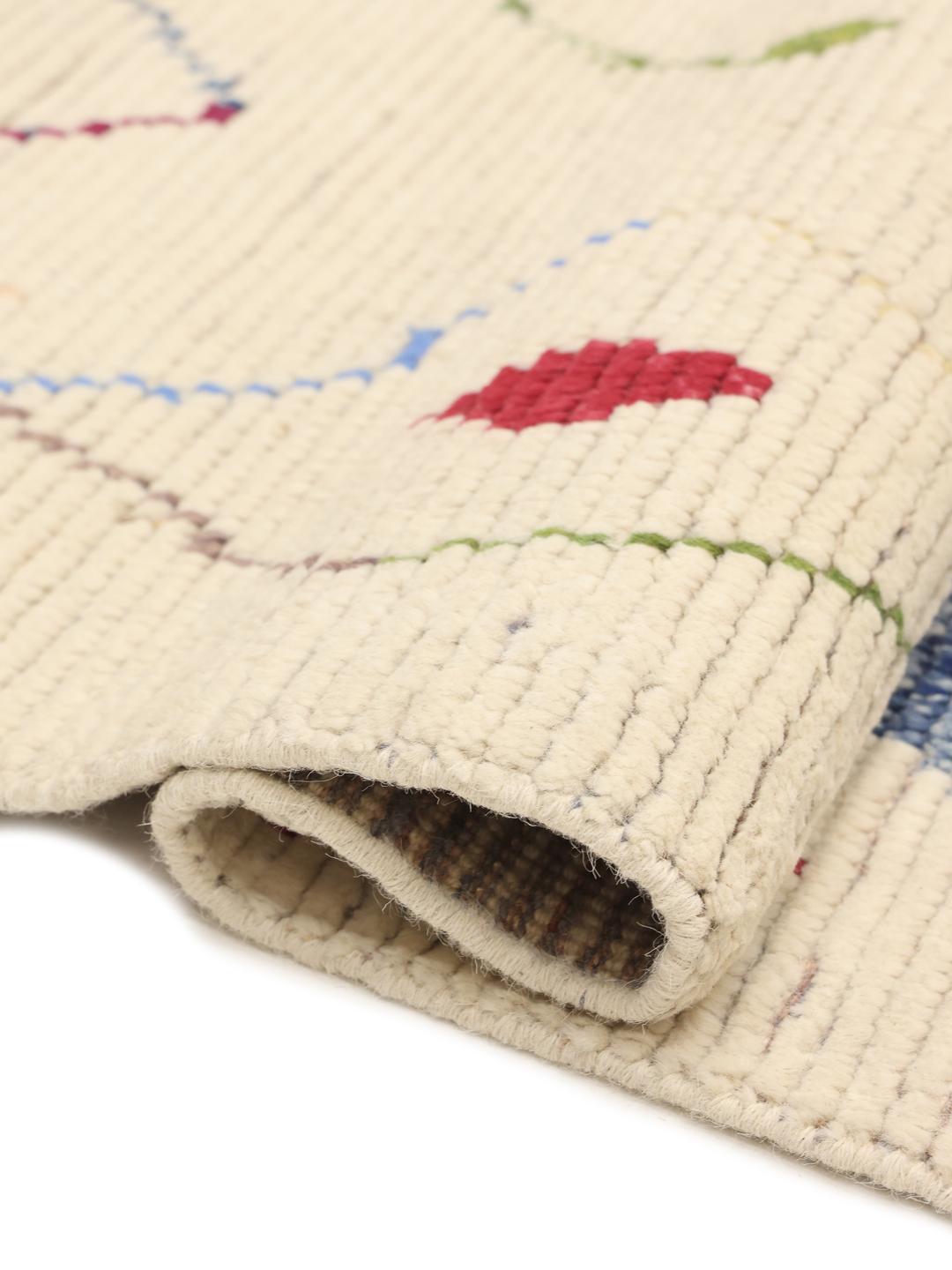 Hand-knotted Afghan rug with colourful geometric motifs on a beige background