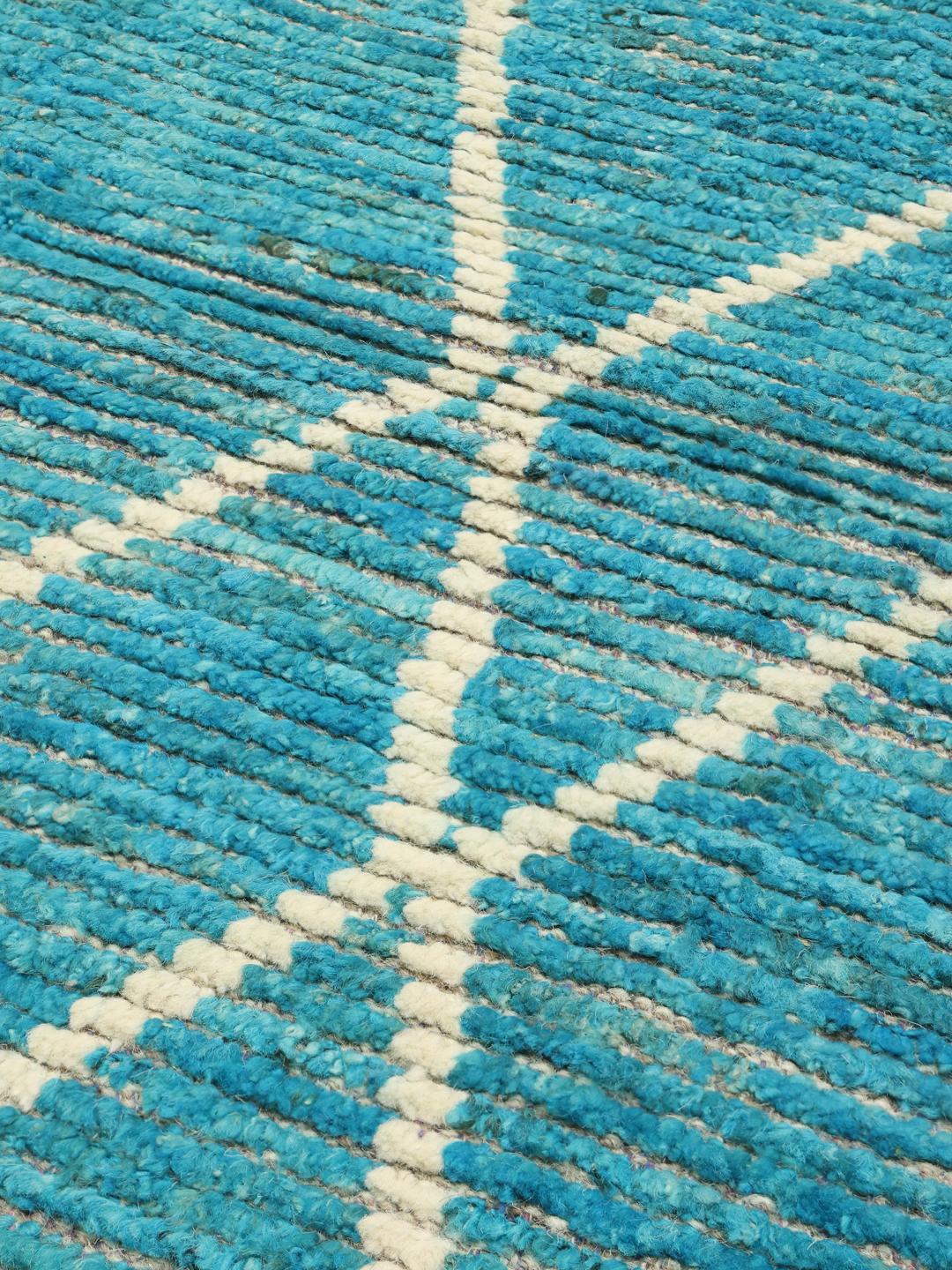 Handgeknoopt teal wollen tapijt uit Afghanistan met een geometrisch patroon
