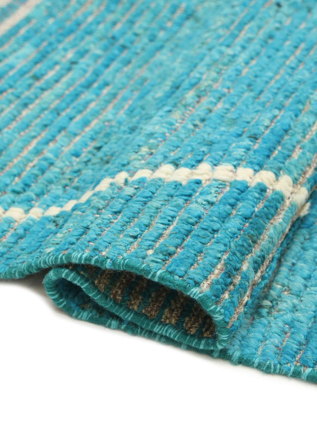 Handgeknoopt teal wollen tapijt uit Afghanistan met een geometrisch patroon