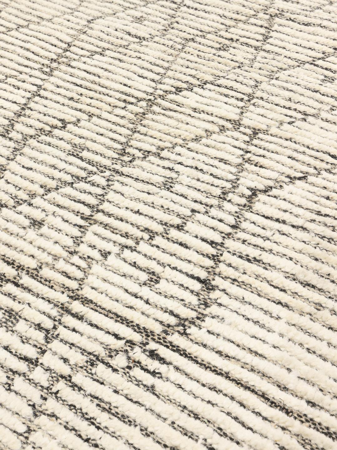 Hand-knotted wool rug with geometric patterns in beige and grey from Afghanistan